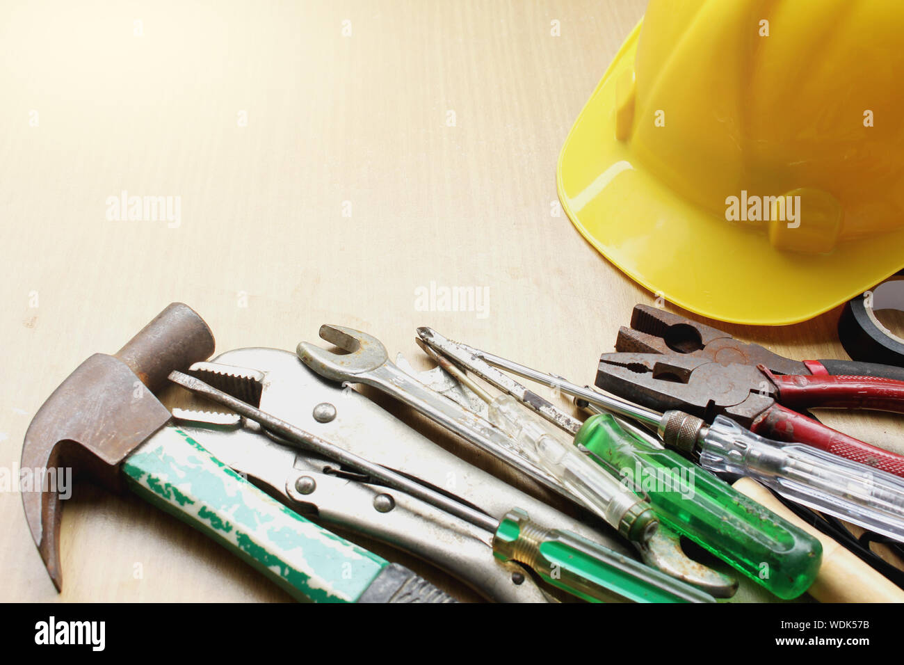 Directly Above Shot Of Work Tools With Hardhat On Table Stock Photo