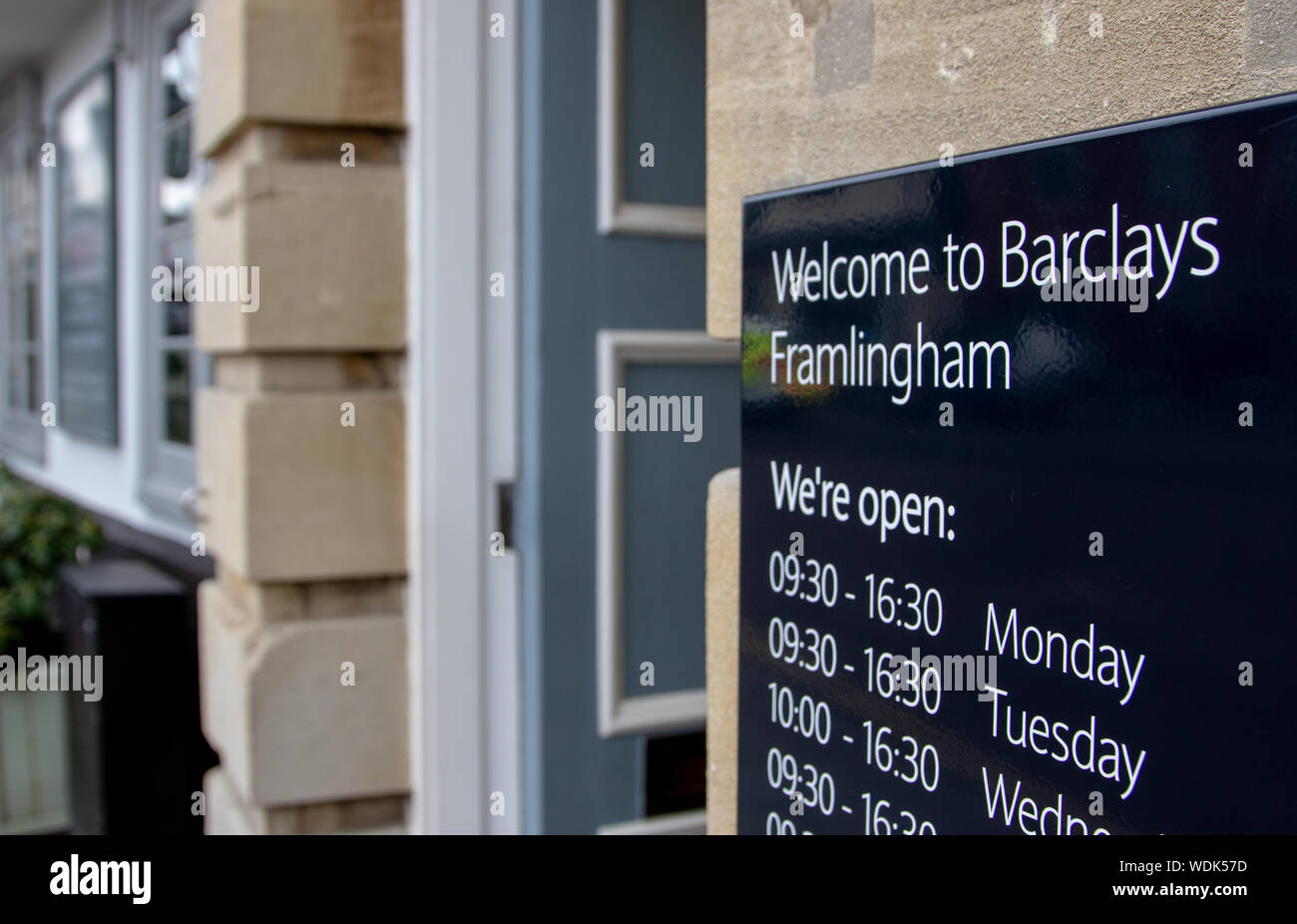 Opening hours sign by the entrance to a Barclays Bank Stock Photo Alamy