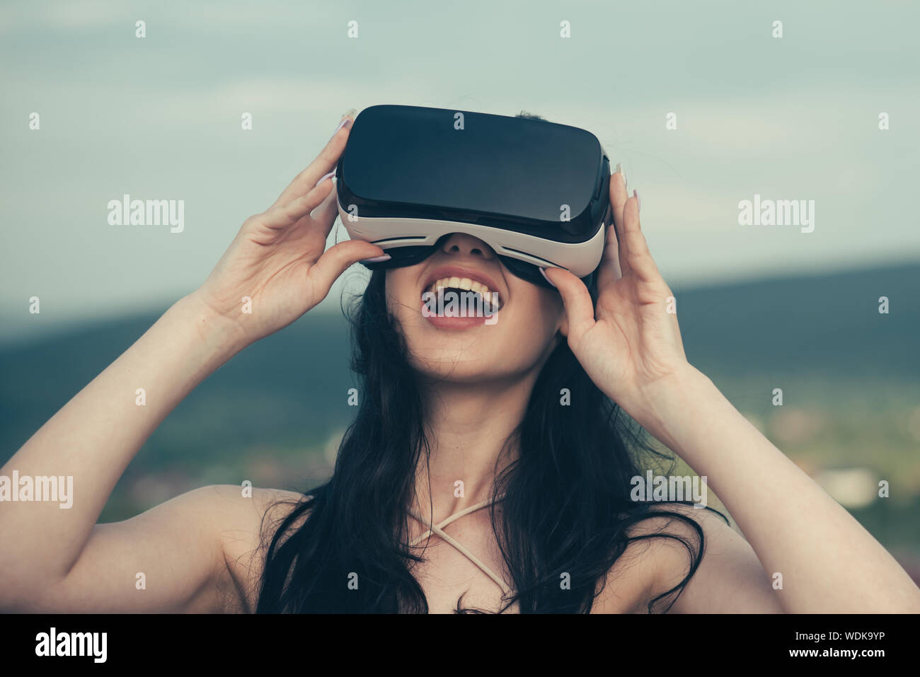 Woman getting experience using VR-headset glasses. Digital future and  innovation. Visual reality concept. Woman with glasses of virtual reality.  Happy Stock Photo - Alamy