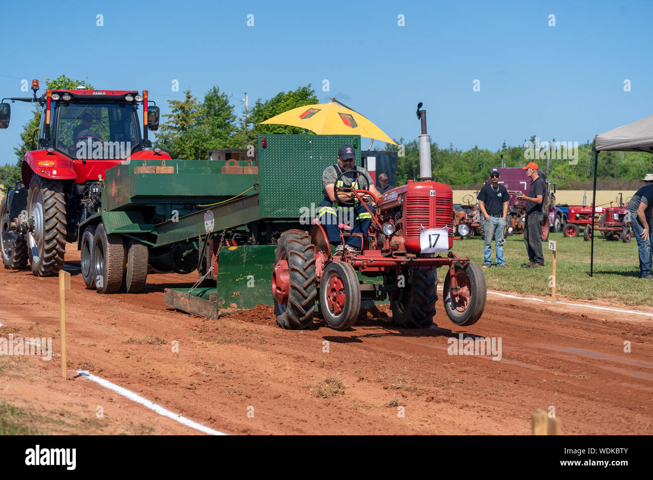 Dundas, Prince Edward Island / Canada - August, 25, 2019: Competitors with their tractors hauling a weighted sled in the annual tractor pull competito Stock Photo