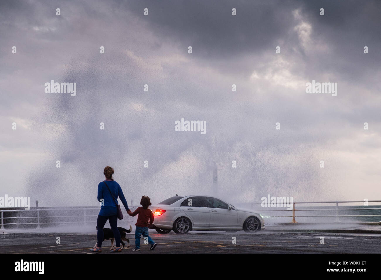 Aberystwyth Wales UK,Thursday 29 August 2019 UK Weather: Strong winds and high tides combine to drive waves crashing against the seafront in Aberystwyth, west Wales, as a period of unsettled weather dominates the UK after the record breaking hot  August Bank Holiday weekend. Photo credit Keith Morris / Alamy Live News Stock Photo