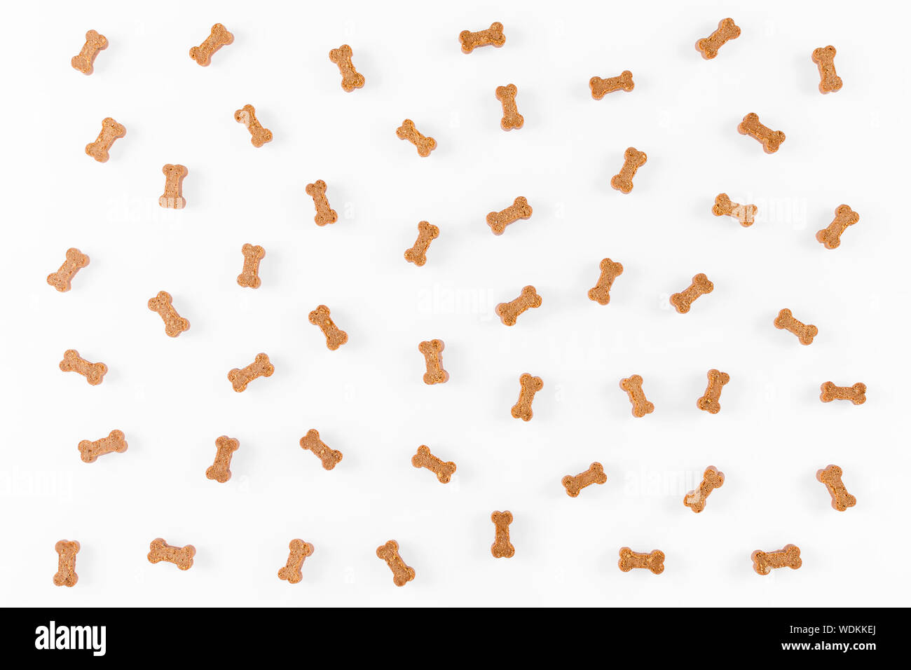 dog snack like bones on white background, flat lay Stock Photo - Alamy