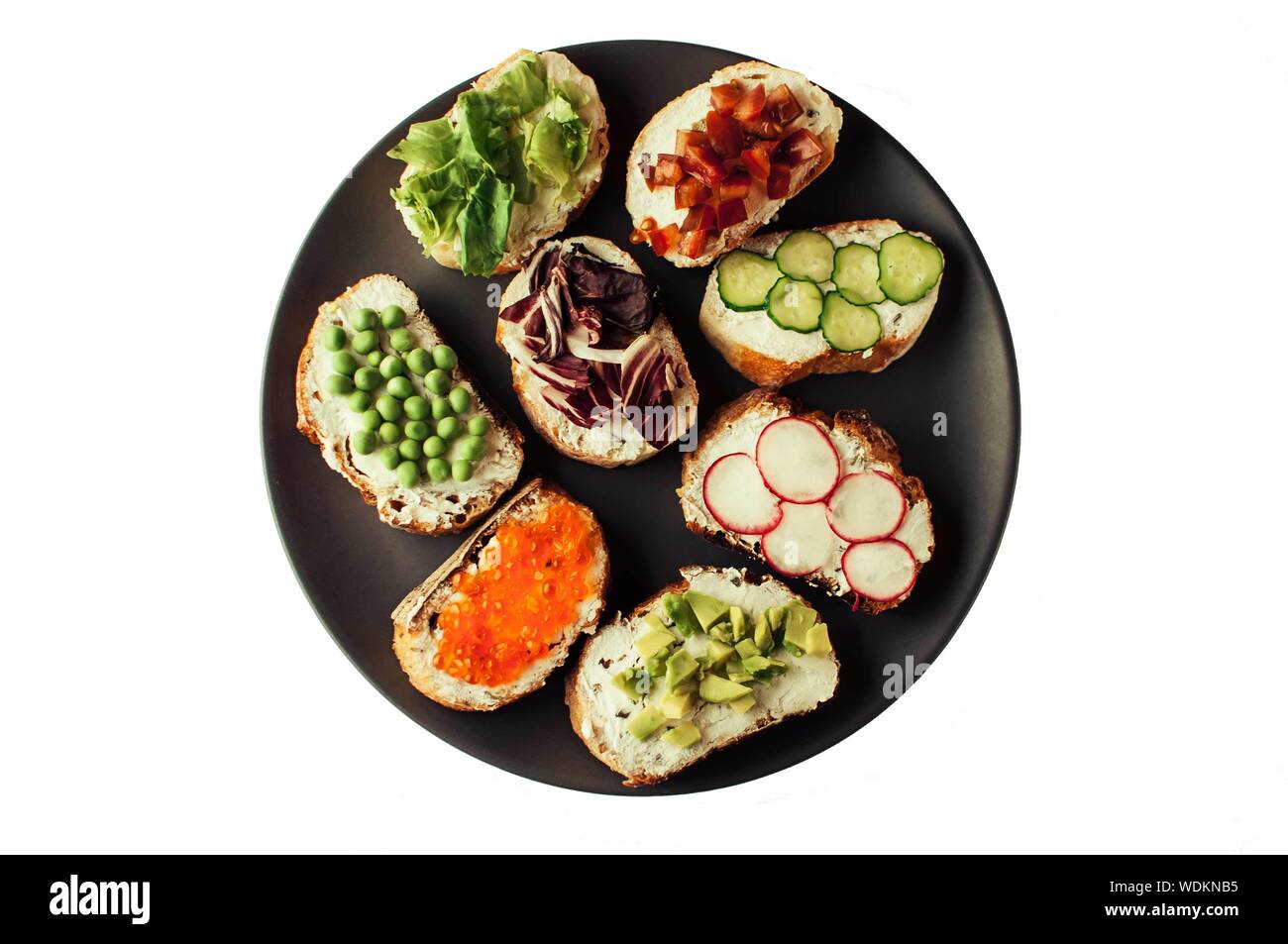 Sandwiches or tapas prepared with bread and tasty ingredients. Could be nice food for healthy breakfast ot lunch. Horizontal orientation Stock Photo