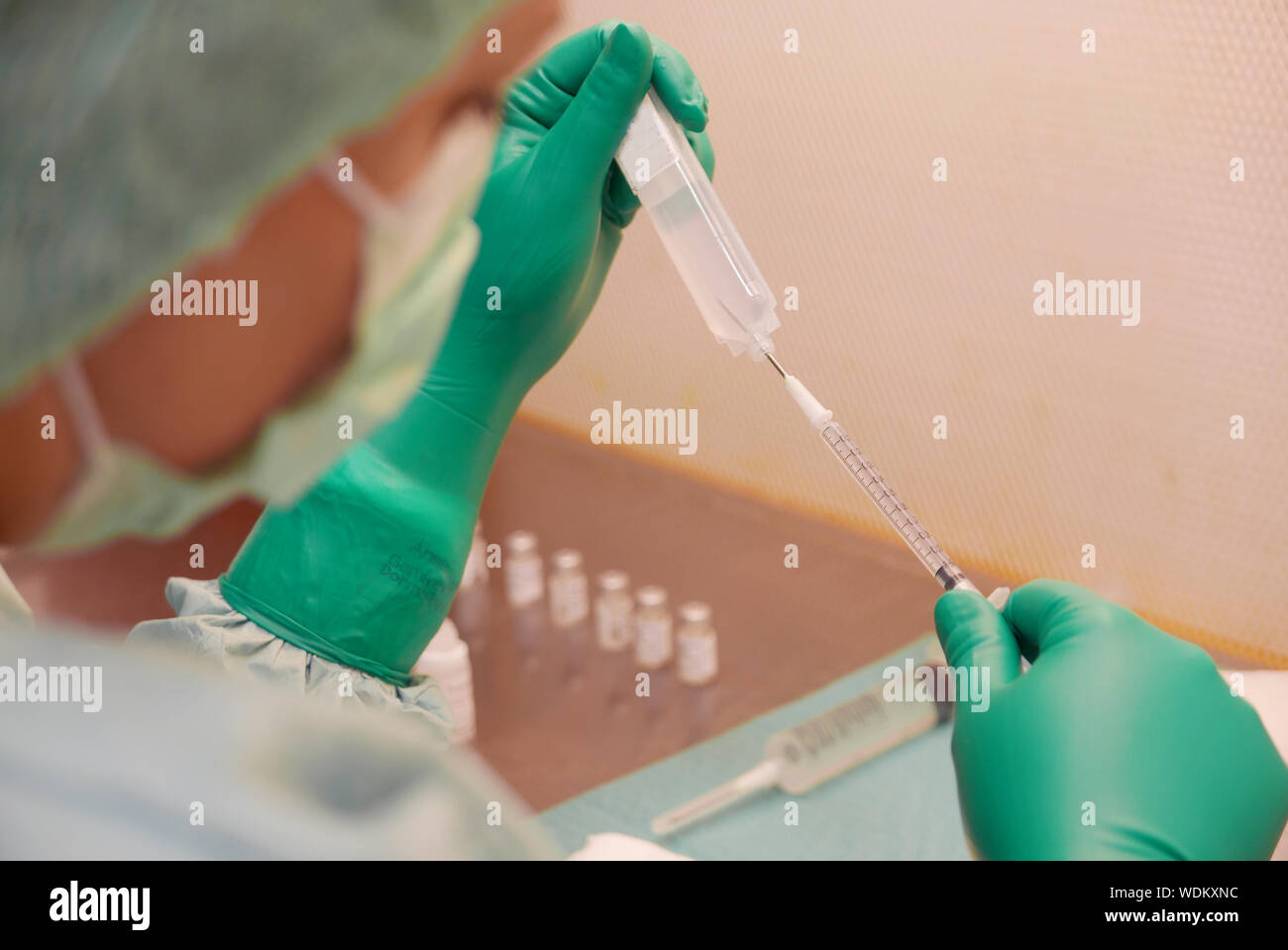 Cropped Image Of Doctor Filling Syringe Stock Photo