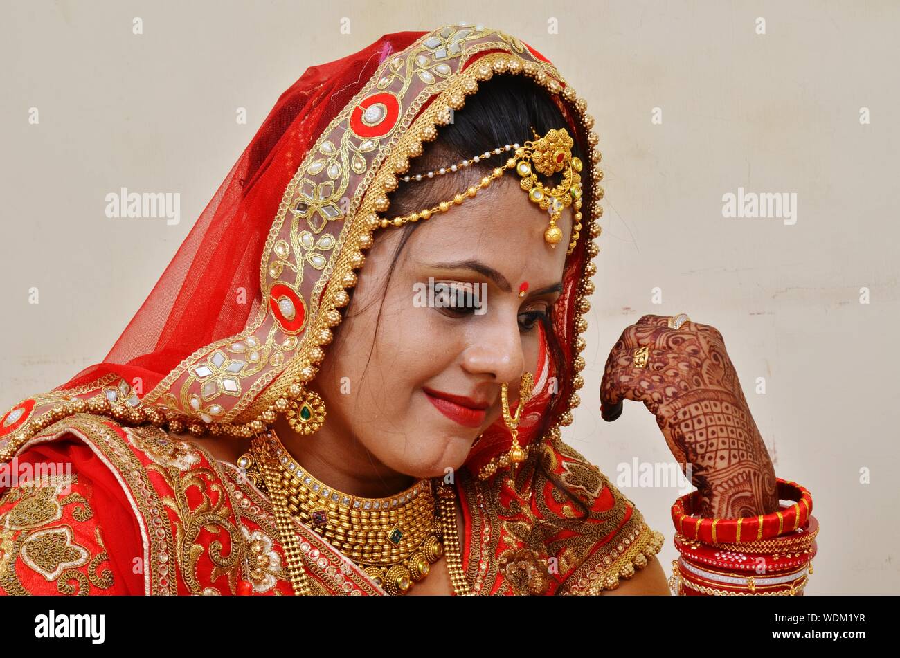 Close-up Of Bride Wearing Red Sari By Wall Stock Photo - Alamy