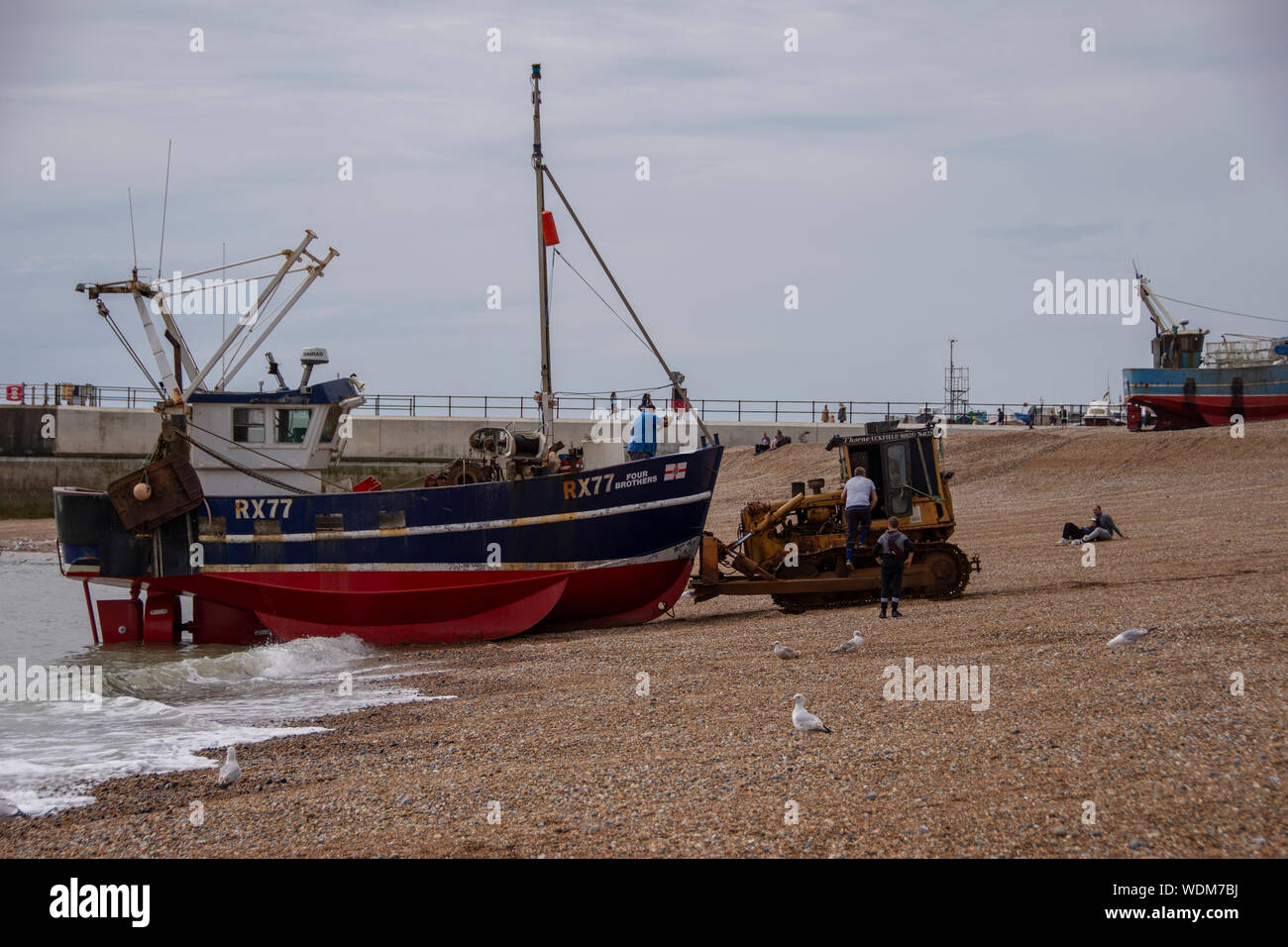 Boats on Hastings Beach UK Stock Photo - Alamy