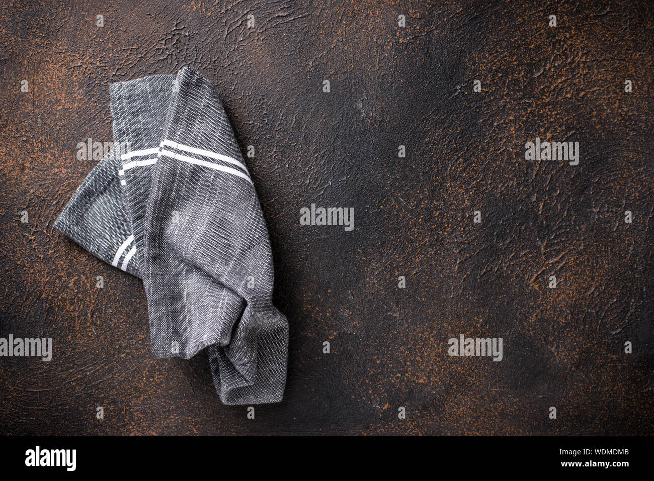Gray linen napkin on rusty table Stock Photo