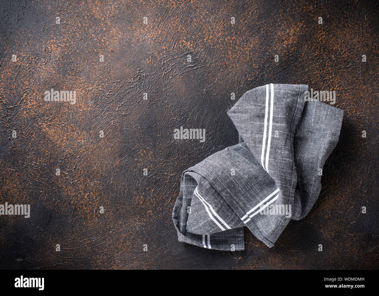 Gray linen napkin on rusty table Stock Photo