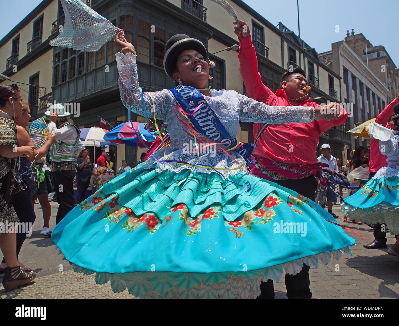 Couple of dancers wearing a traditional costume as part of the Virgin of  Candelaria festival in the main streets of Lima downtown. Original from  Puno, the festival was brought to Peru's capital