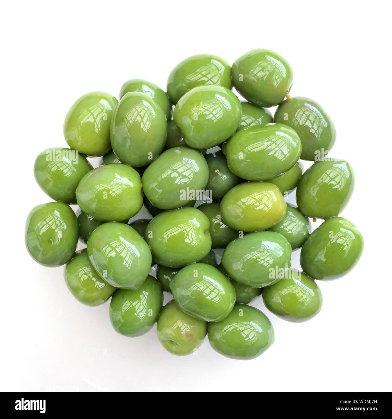 Directly Above Shot Of Green Olive Over White Background Stock Photo
