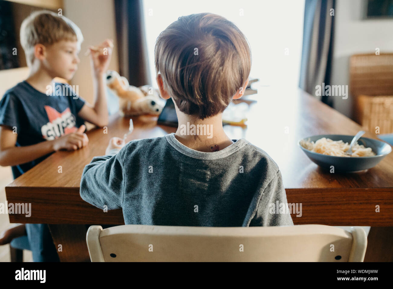 Boy sitting on table hires stock photography and images Alamy