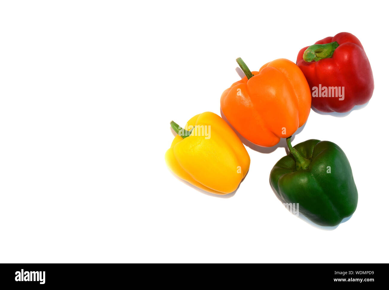 Fresh vegetables. Orange, yellow, green, red bell peppers or capsicum isolated on white background, copy space Stock Photo