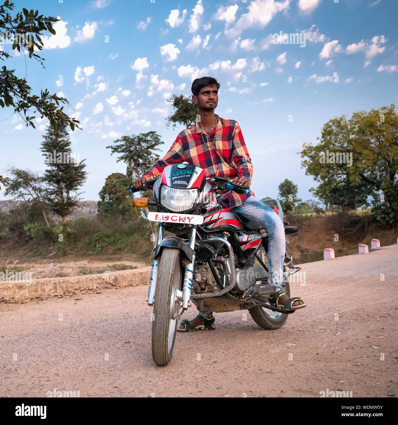 Indian man sitting on motorbike hi res stock photography and images Alamy