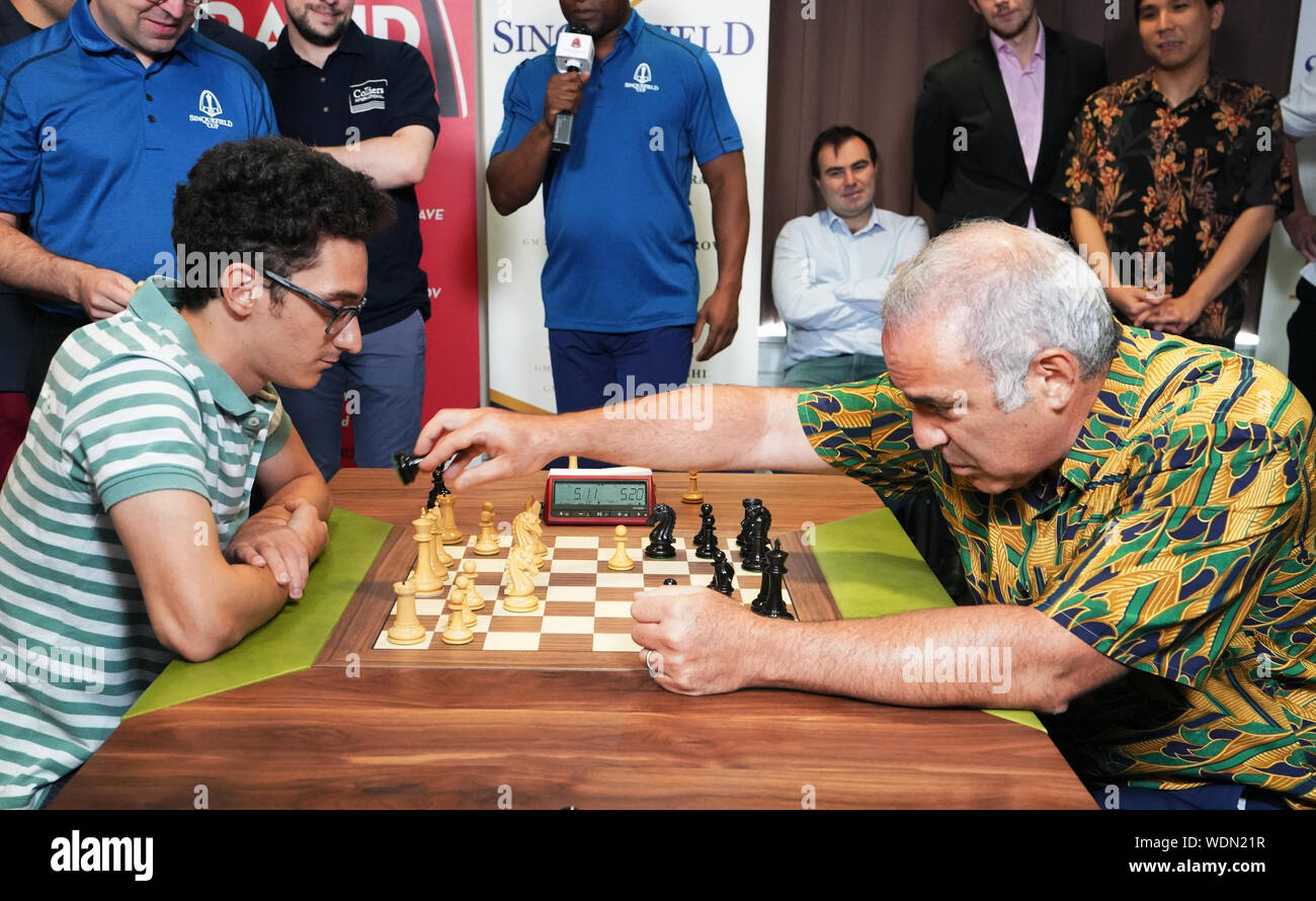St. Louis, United States. 29th Aug, 2019. Chess Grand Master, Garry Kasparov (R) makes a move as he plays Grand Master Fabiano Caruana in the first game of exhibition team play for those that participated in the Sinquefield Cup Tournament at the Saint Louis Chess Club in St. Louis on Thursday, August 29, 2019. Kasparov, the former world chess champion, is considered to be the greatest chess player of all time. Photo by Bill Greenblatt/UPI Credit: UPI/Alamy Live News Stock Photo