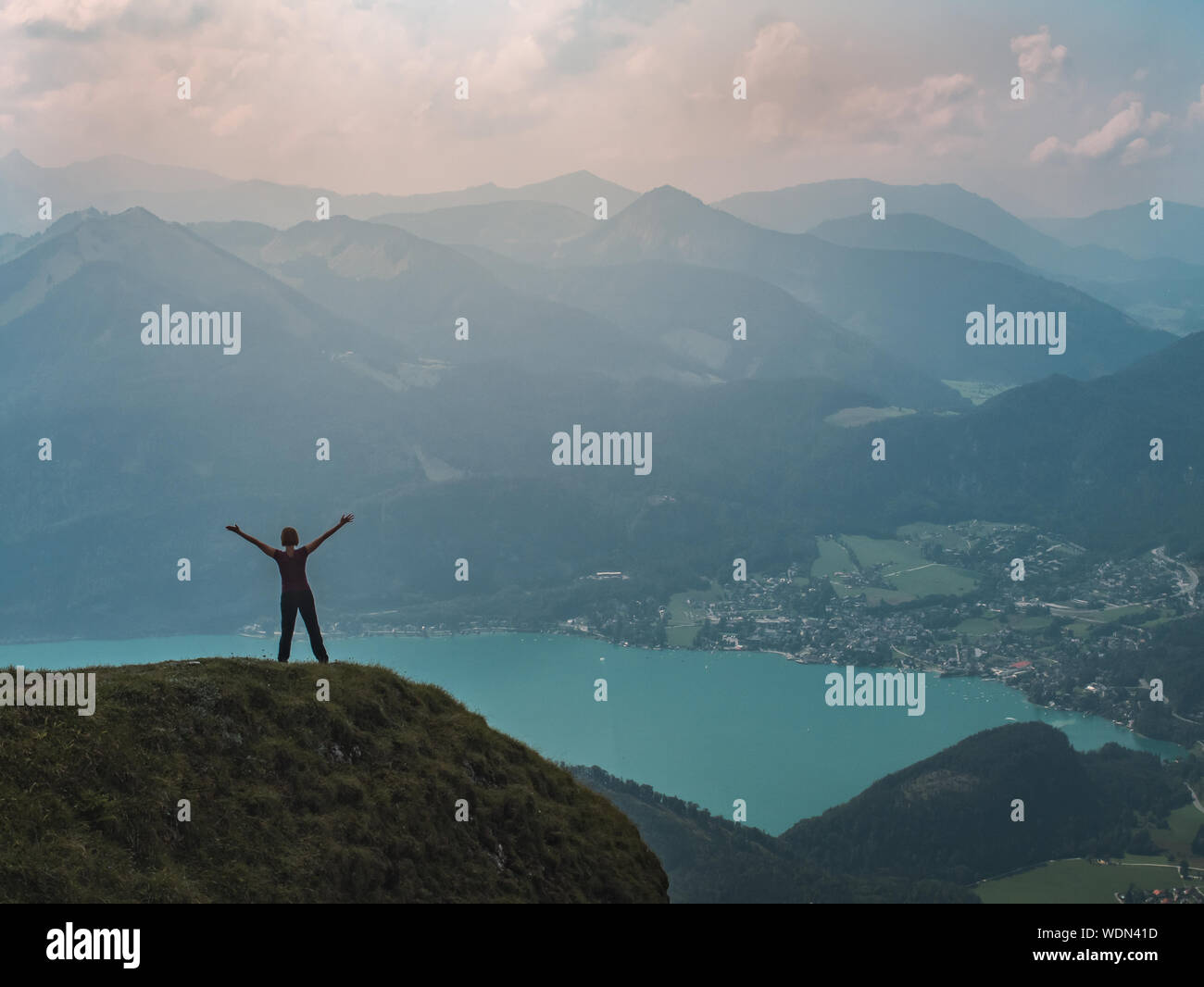 Woman standing on mountain top hi-res stock photography and images - Alamy