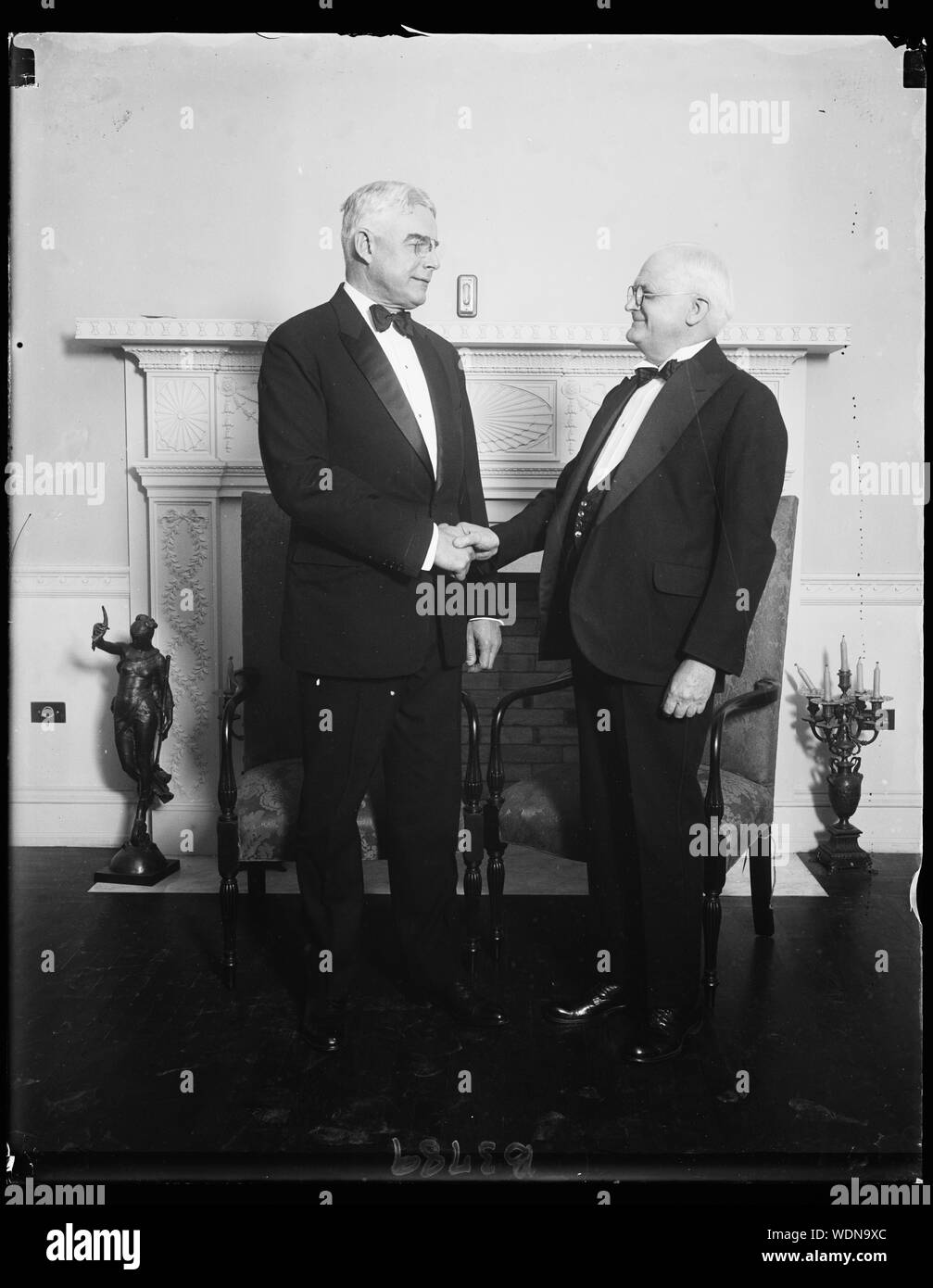 Governor boom. D.C. Governor Albert C. Ritchie (left) of Maryland greeting Governor John Garland Polland before they spoke last night in behalf of greater Washington Abstract/medium: 1 negative : glass  4 x 5 in. or smaller Stock Photo