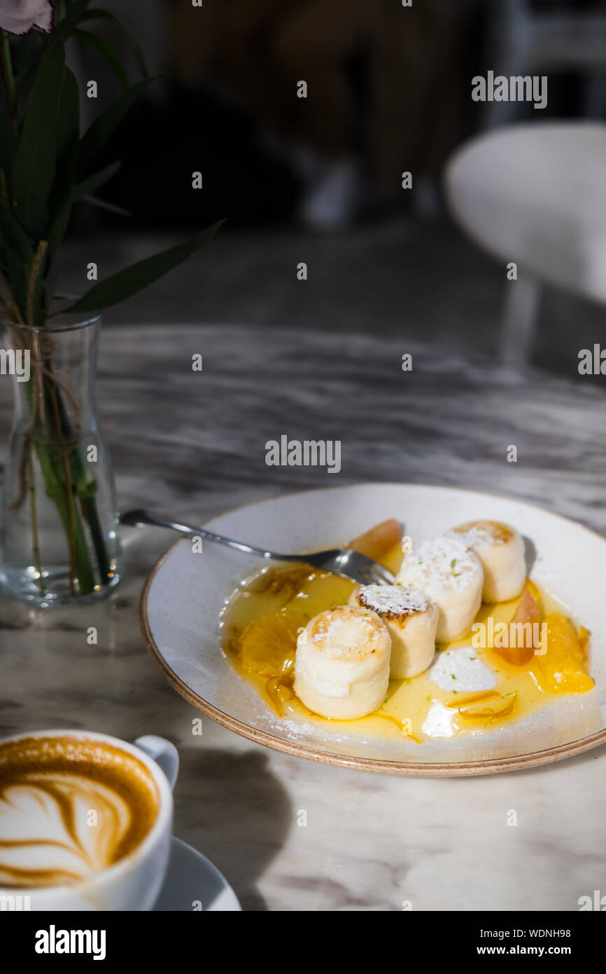Cottage Cheese Pancakes With Orange Jam On White Plate Marble