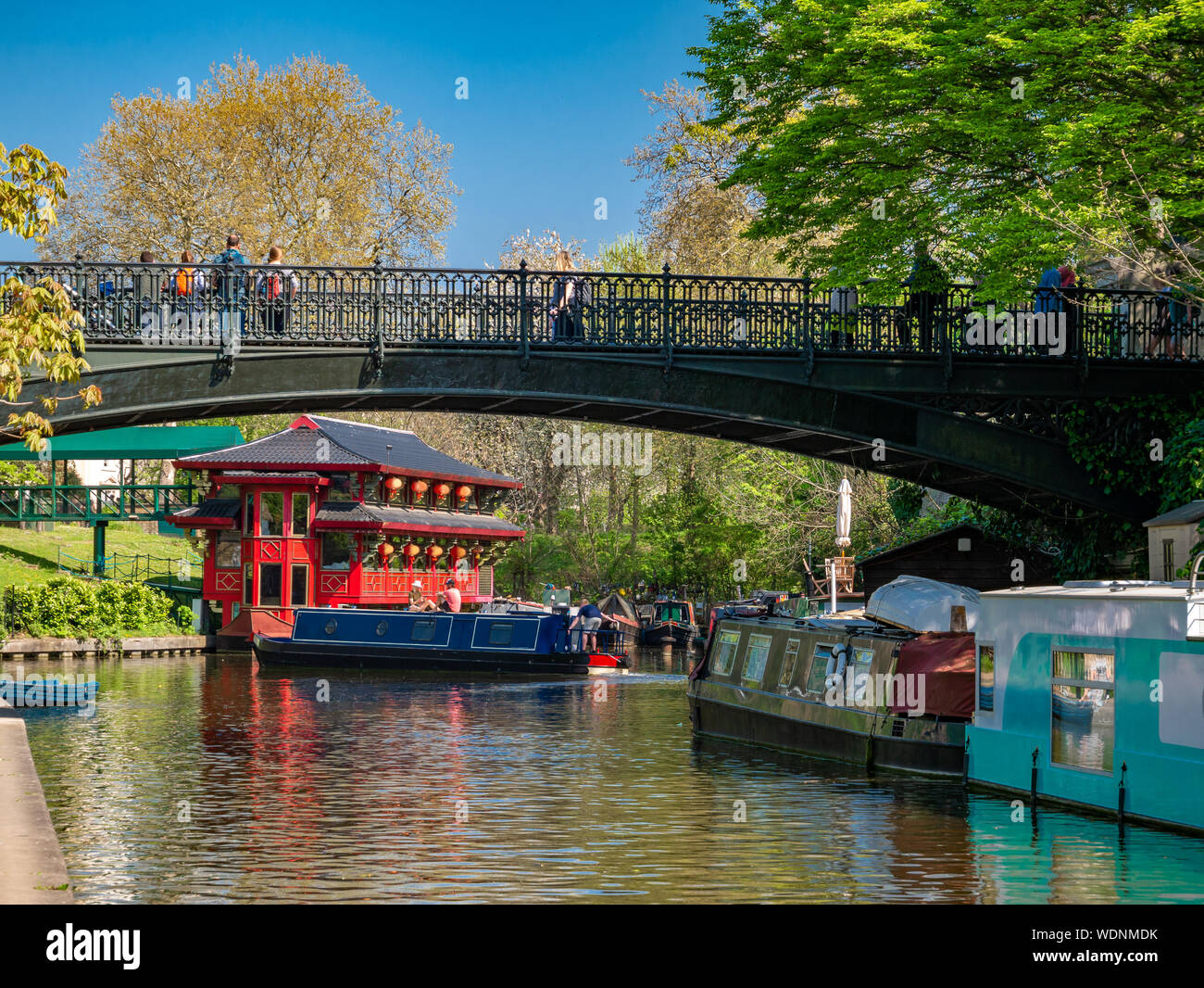 Beautiful region of Camden town in Regents park area with boats on canal and Chinese small temple next to the bridge in London, England Stock Photo