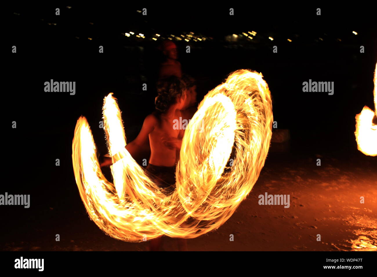 Fire Dancer Performing At Night Stock Photo Alamy