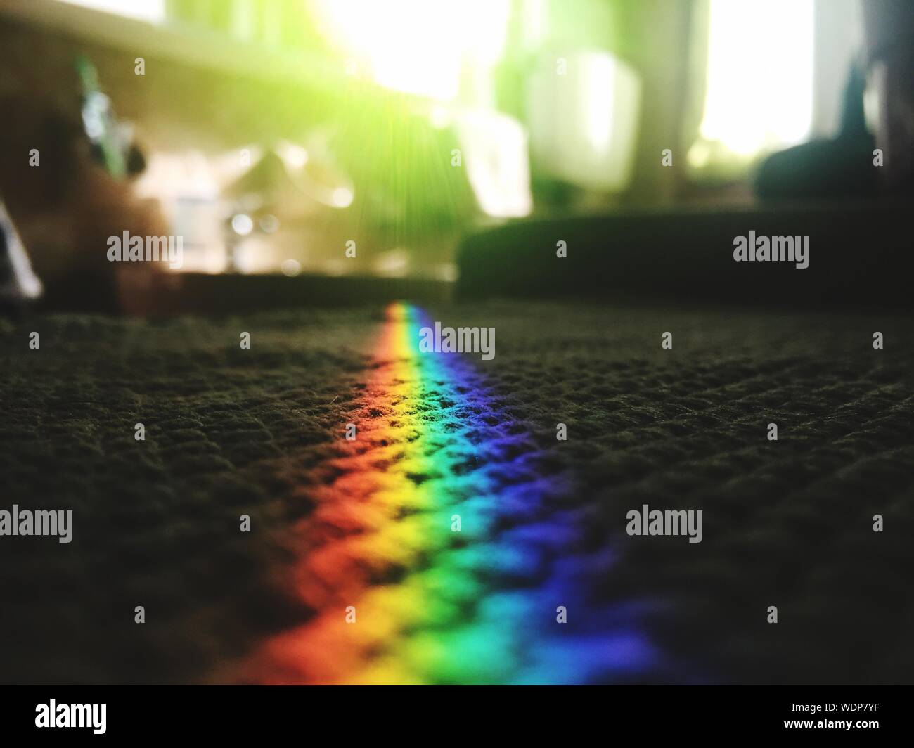 Prism Rainbow Light On Carpet At Home Stock Photo