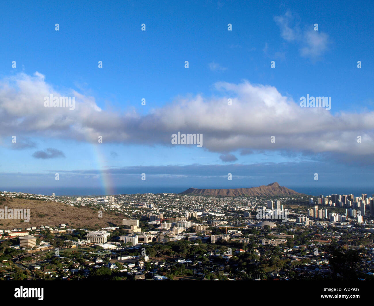 Rainbow over Manoa, the city of Honolulu, and Diamond Head on the island of Oahu in the state of Hawaii on a beautiful day. Stock Photo