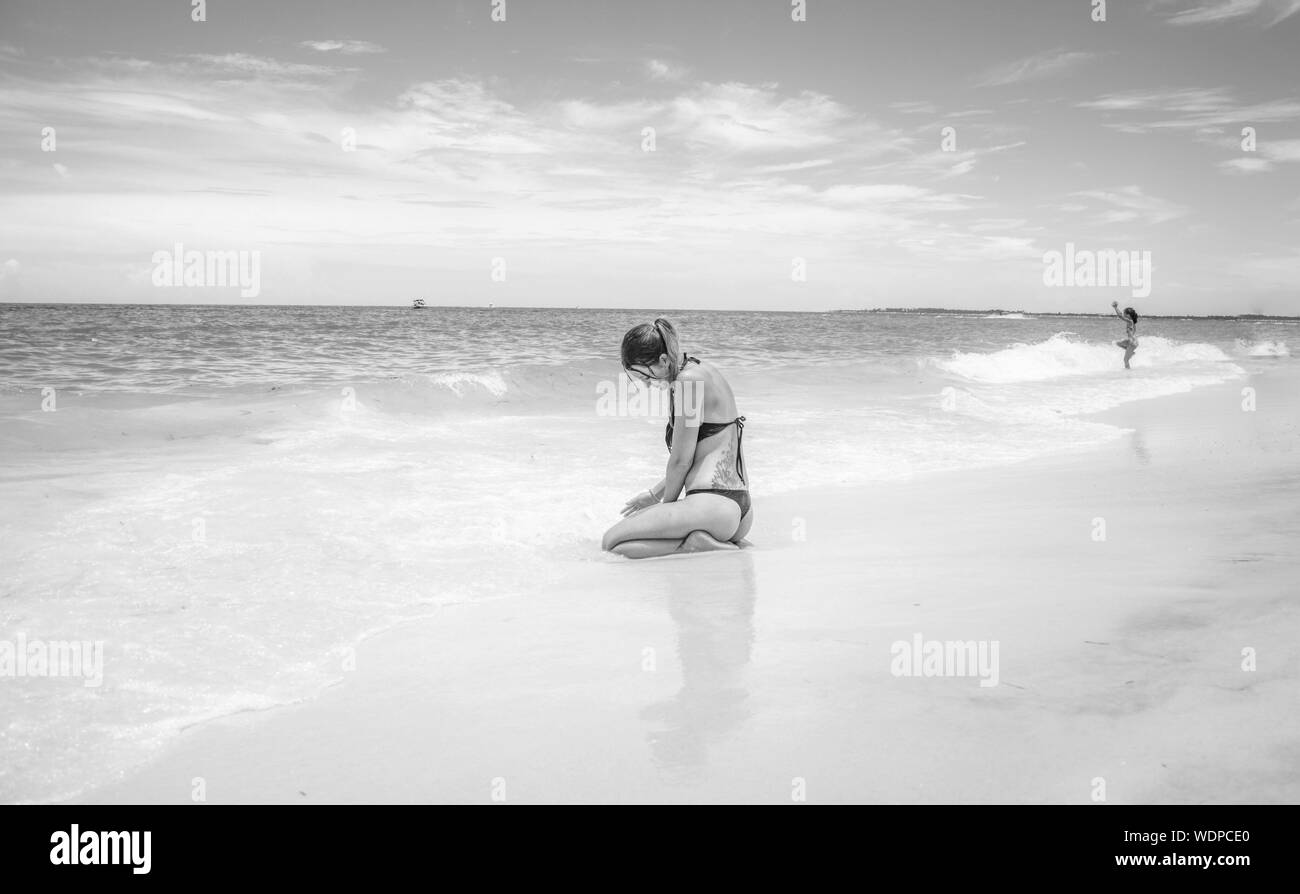 Woman sand kneeling Black and White Stock Photos & Images - Alamy