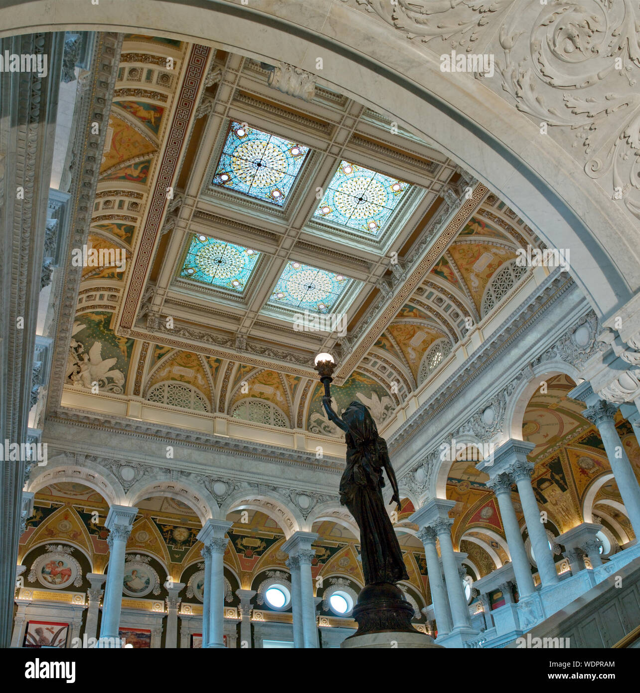 Great Hall. View of ceiling with bronze statue of female figure on newel post holding a torch of electric light. Library of Congress Thomas Jefferson Building, Washington, D.C. Stock Photo