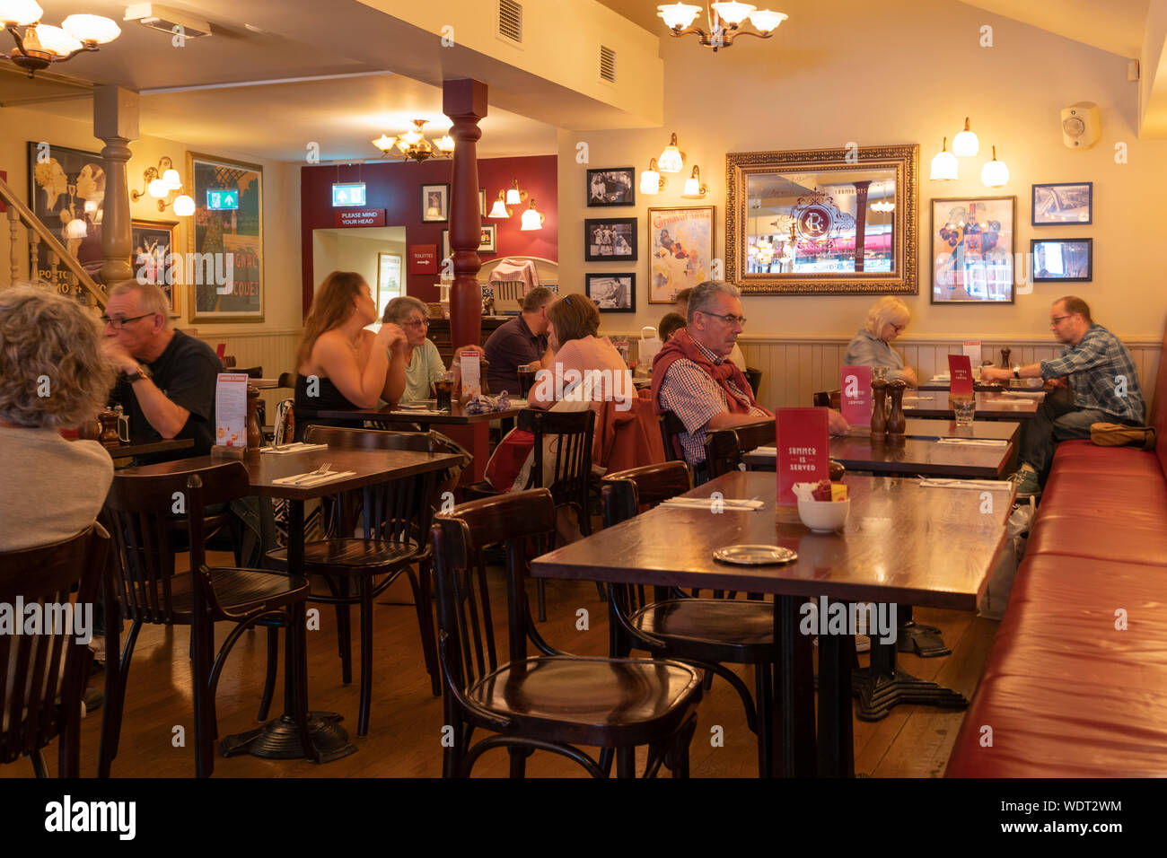 Diners at lunch time at Cafe Rouge in Worcester - a chain bistro with a retro Parisian setting Stock Photo