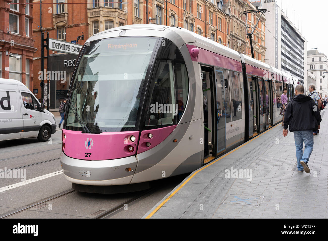A tram on Corporation Street, Birmingham. Part of the West Midlands Metro, a light-rail / tramway network Stock Photo