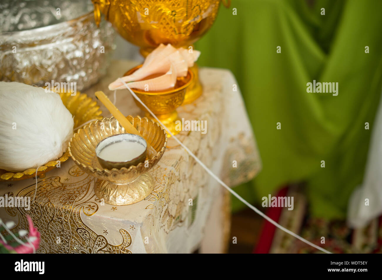 High Angle View Of Bowls And Seashell By Vase On Table Stock Photo