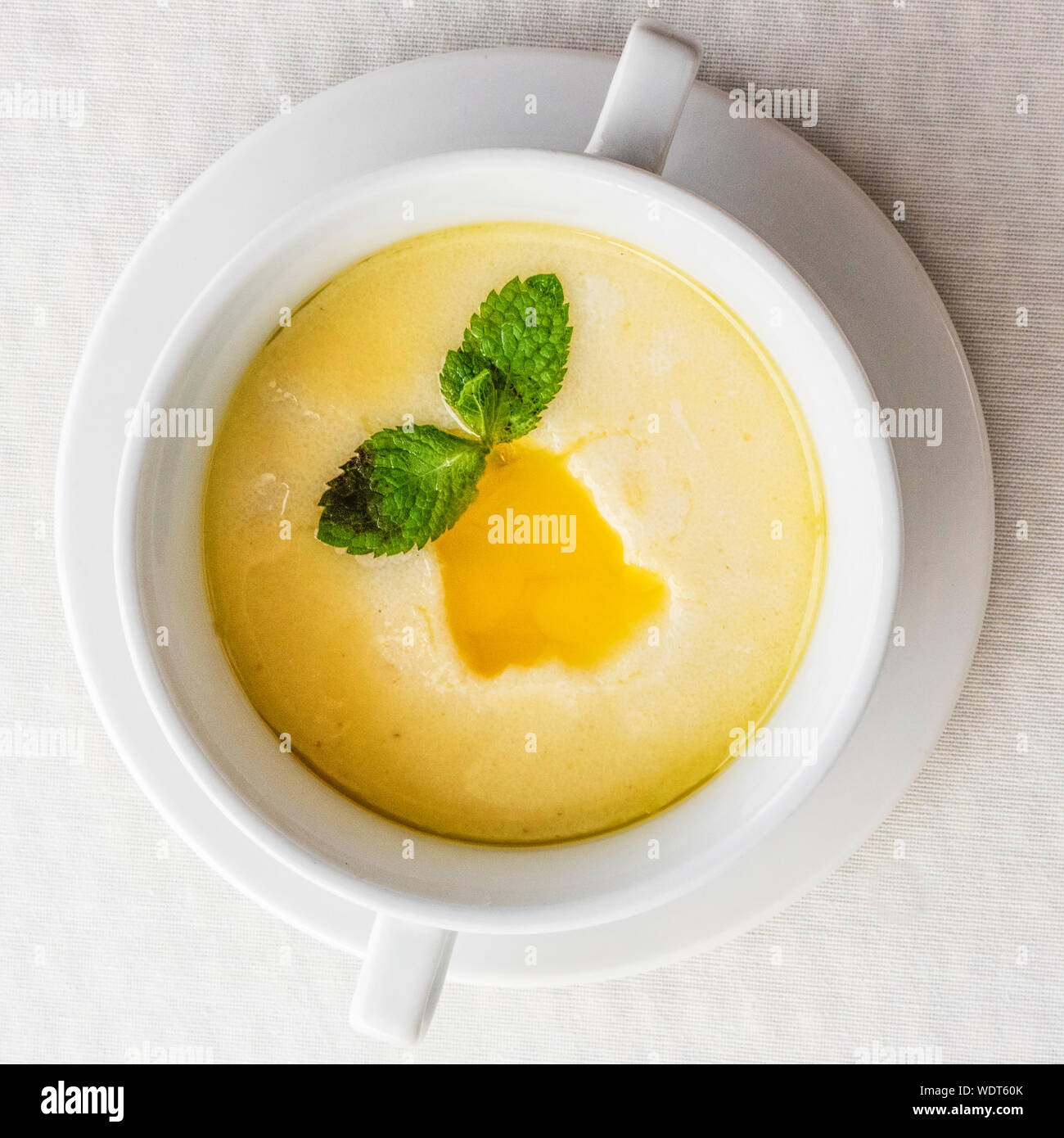 Directly Above Shot Of Farina With Milk And Butter Served In Bowl On Orange Table Stock Photo