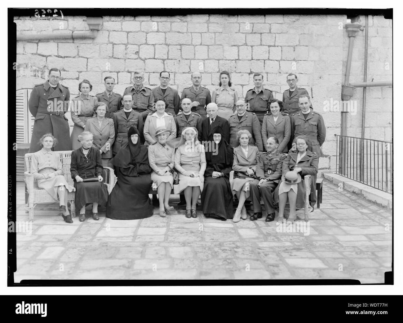 Group of St. Andrew's Hostel workers, taken on terrace of Jer. [i.e., Jerusalem] Hotel, for Mrs. Gayserer Abstract/medium: G. Eric and Edith Matson Photograph Collection Stock Photo