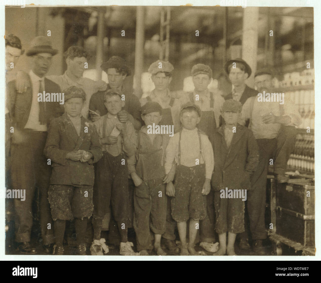 Group of workers in the Massachusetts Mills, Lindale, Ga. Photo taken at noon, April 12, 1913, while they were being paid off. During the days following this, I proved the ages of nearly a dozen of th[ese] children, by gaining access to Family Records, Life Insurance papers, and throug[h] conversations with the children and pare[nts], and found these that I could prove to be working now, or during the past year at 10 and 11 years of age, some of them having begun before they were ten. Further search would reveal more. (See Hine Report). Abstract: Photographs from the records of the National Ch Stock Photo