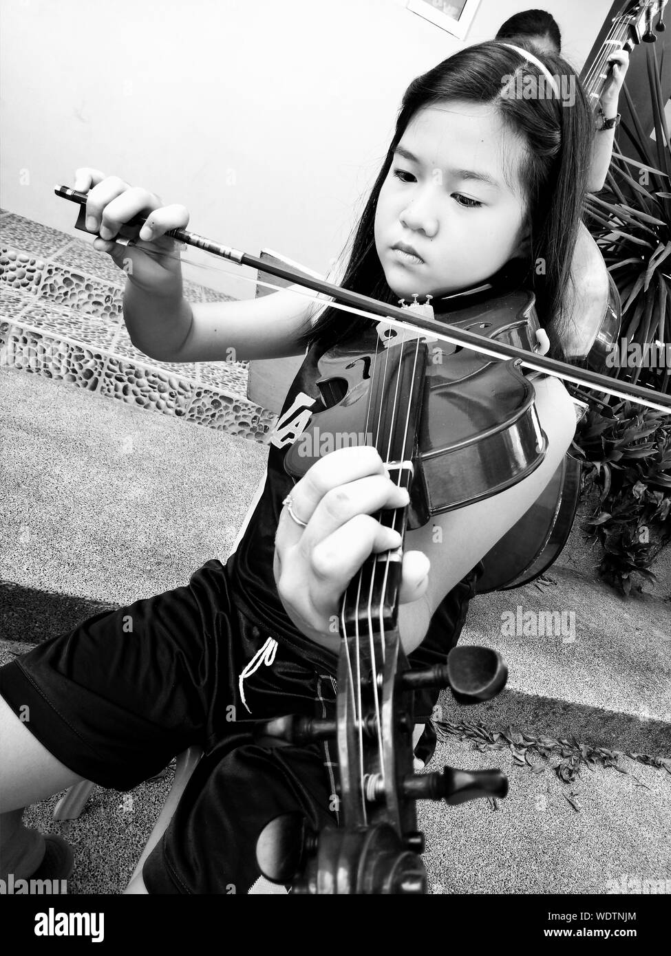 Child playing music Black and White Stock Photos & Images - Alamy