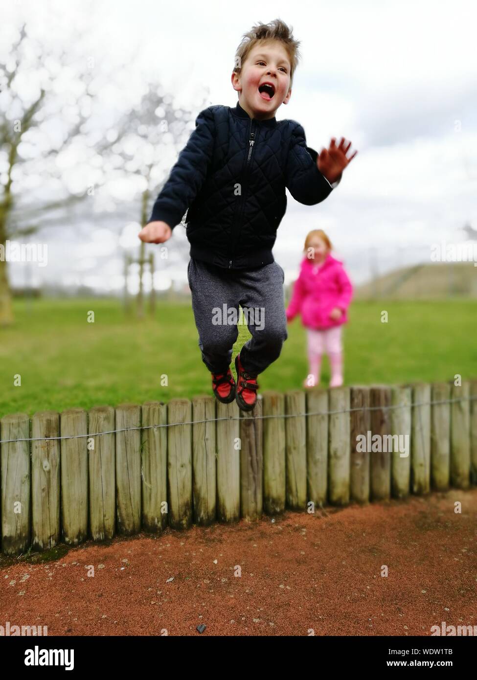 People jumping over fence hi-res stock photography and images - Alamy