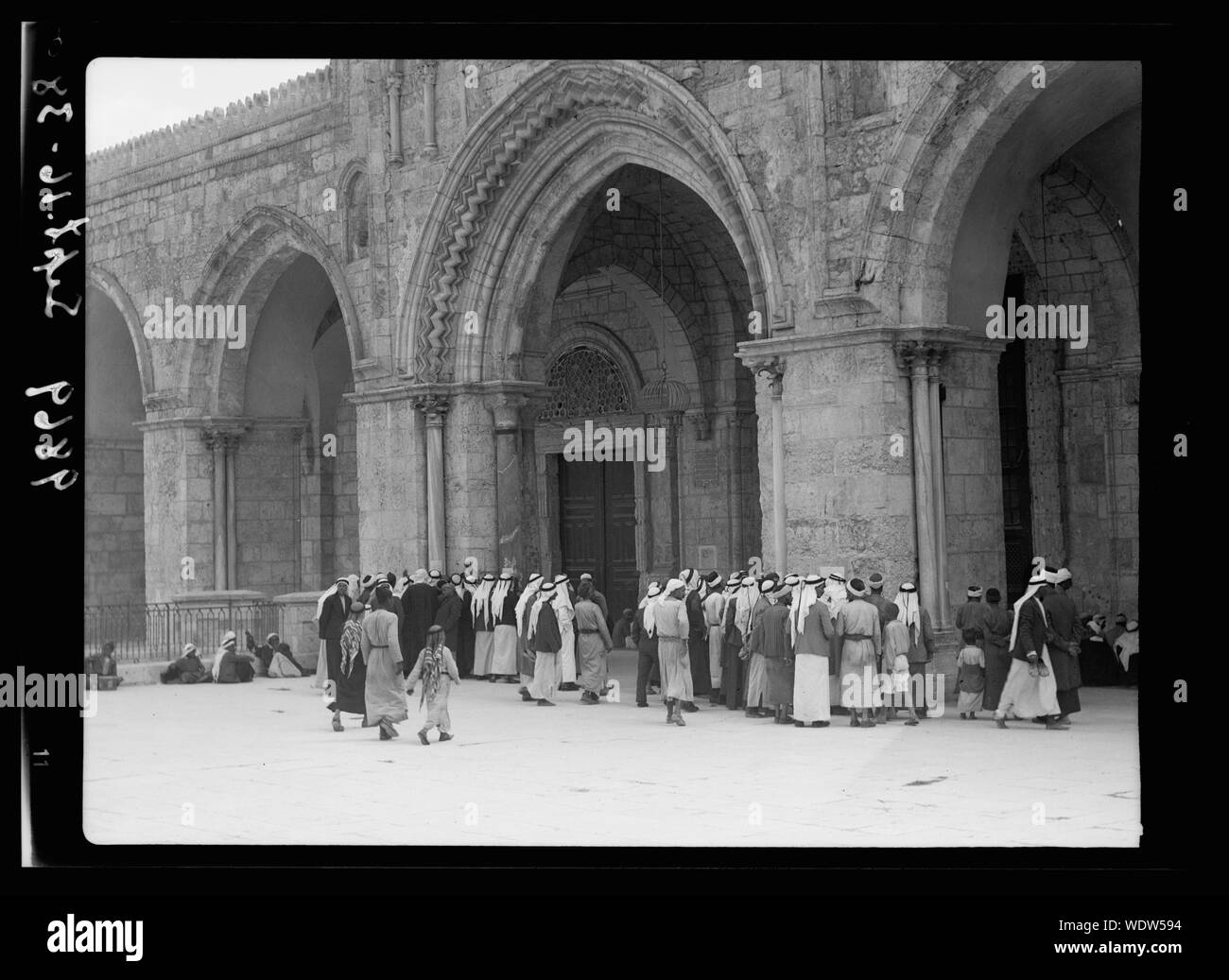 Groups of Arabs before el-Aksa [i.e., al-Aqsa] Mosque reading rebel posters. Friday Sept. 16, 1938 Abstract/medium: G. Eric and Edith Matson Photograph Collection Stock Photo