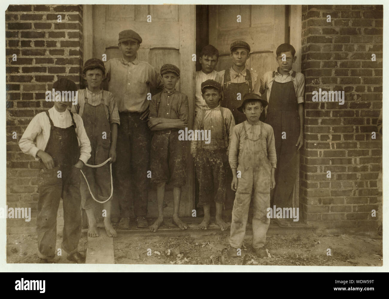 Groups of doffers, etc., all working in the Liberty Cotton Mill, Clayton, N.C., taken at 10:00 A.M., October 29th, 1912. I saw a few very young spinners, one apparently ten years old, working, but could not get them out. Abstract: Photographs from the records of the National Child Labor Committee (U.S.) Stock Photo