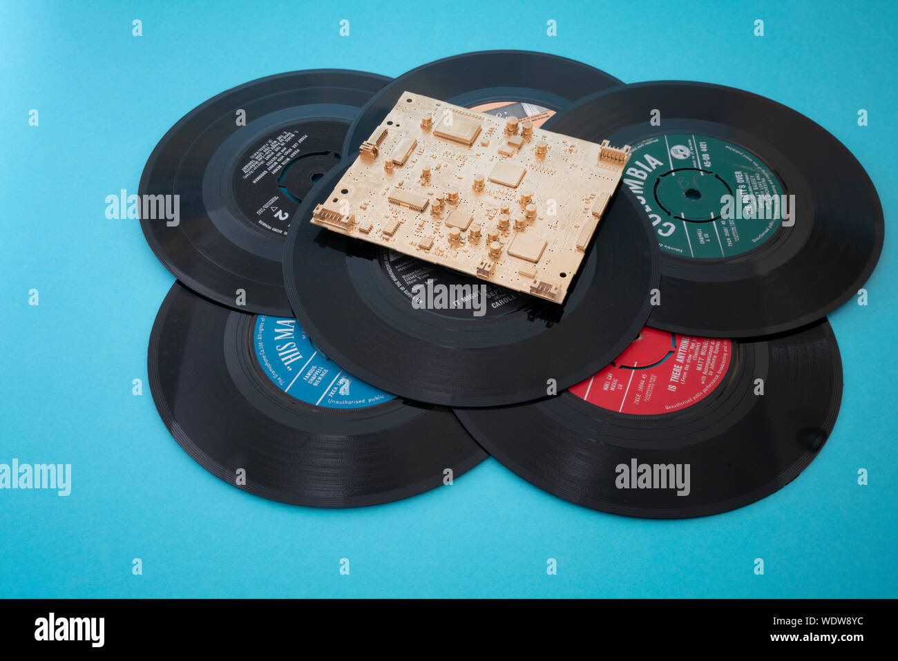 Old vinyl records with gold digital chip Stock Photo
