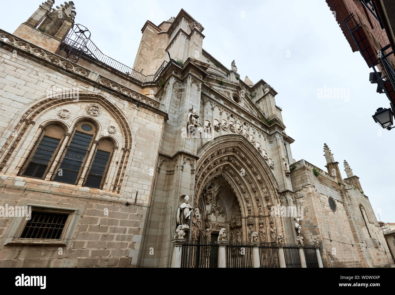 TOLEDO, SPAIN - APRIL 24, 2018: Horizontal panorama of the Portal of the Lions, the most modern gate of the Primal Cathedral of Saint Mary of Toledo. Stock Photo