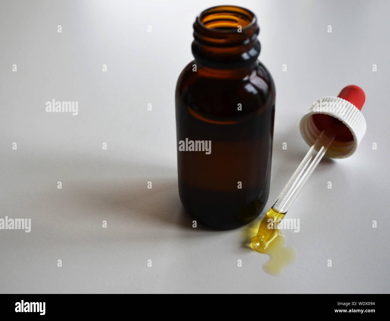 Bottle of Cannabis CBD THC oil with pipette Stock Photo