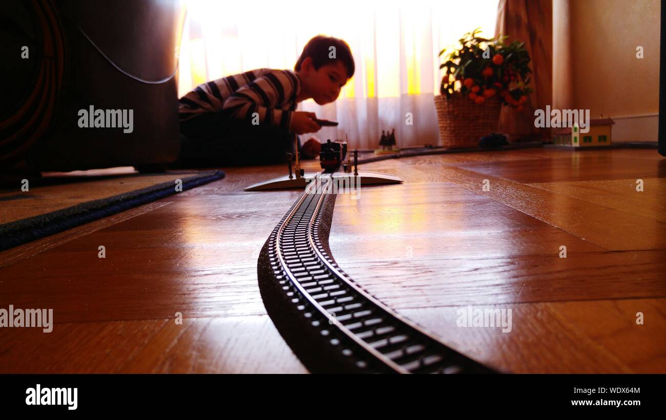 Boy Playing With Toy Train At Home Stock Photo Alamy