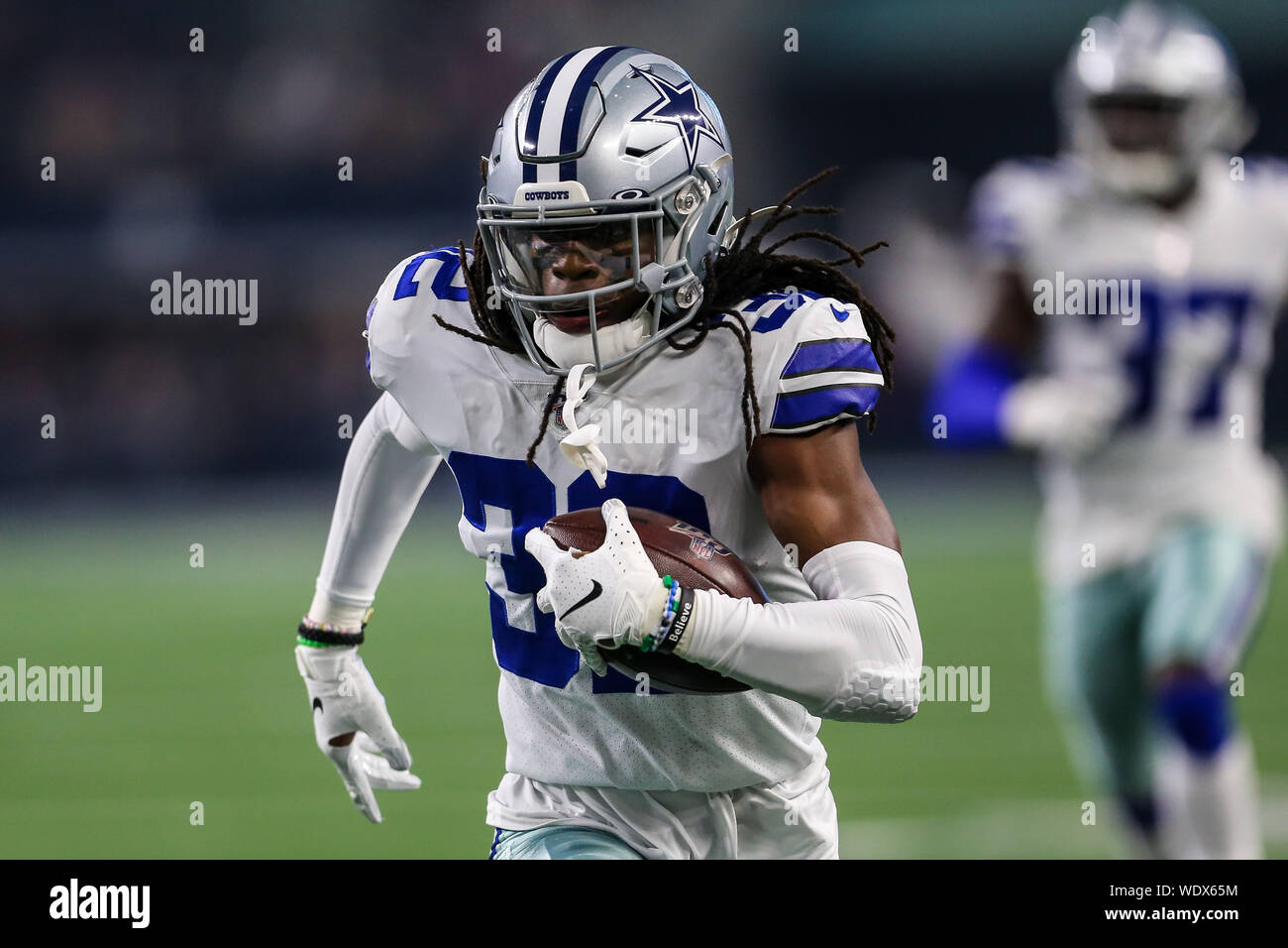 Aug 29, 2019: Dallas Cowboys cornerback Donovan Olumba #32 carries the ball  back for a touchdown after making an interception in the first quarter  during an NFL preseason game between the Tampa