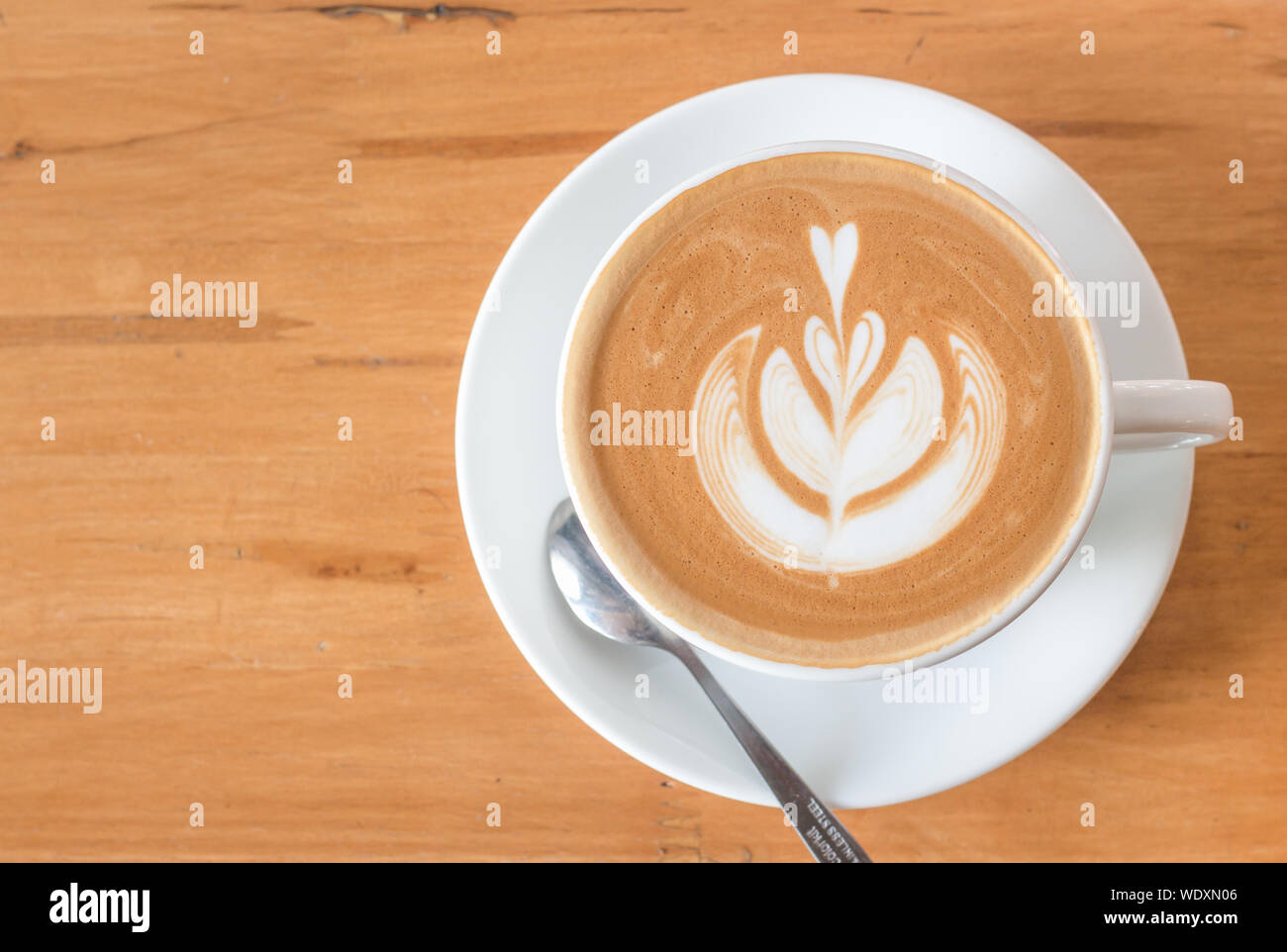 Directly Above Shot Of Cappuccino With Froth Art On Table Stock Photo