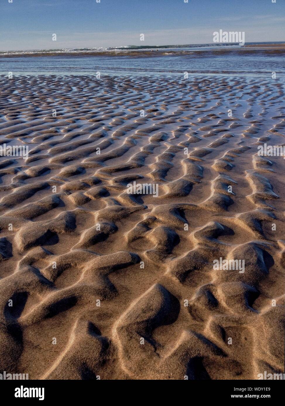 Natural Pattern Formed By Sand At Beach Stock Photo