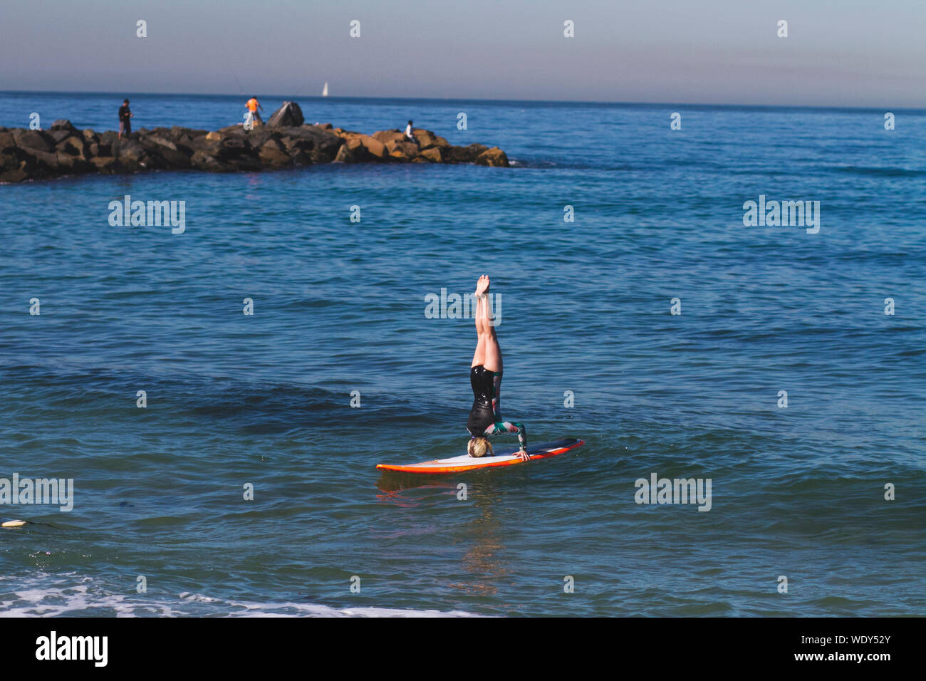 Headstand on surfboard hires stock photography and images Alamy