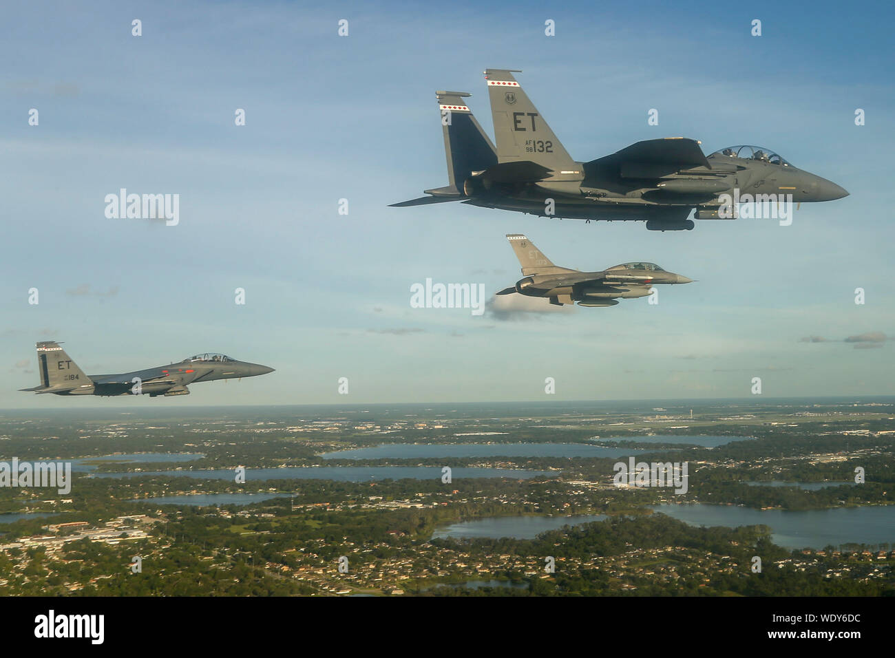 Two F-16D Fighting Falcons and two F-15E Strike Eagles from the 96th Test Wing, Eglin AFB, Fla., perform a formation flyover of the National Collegiate Athletic Association football season opener in Orlando, Fla., Aug 24, 2019. The Miami Hurricanes played against the Florida Gators during the first football game of the 2019 season. (U.S. Air Force photo by SrA Joshua Hoskins) Stock Photo