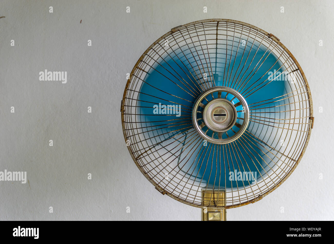 Vintage old white stand fan with blue blades Stock Photo Alamy
