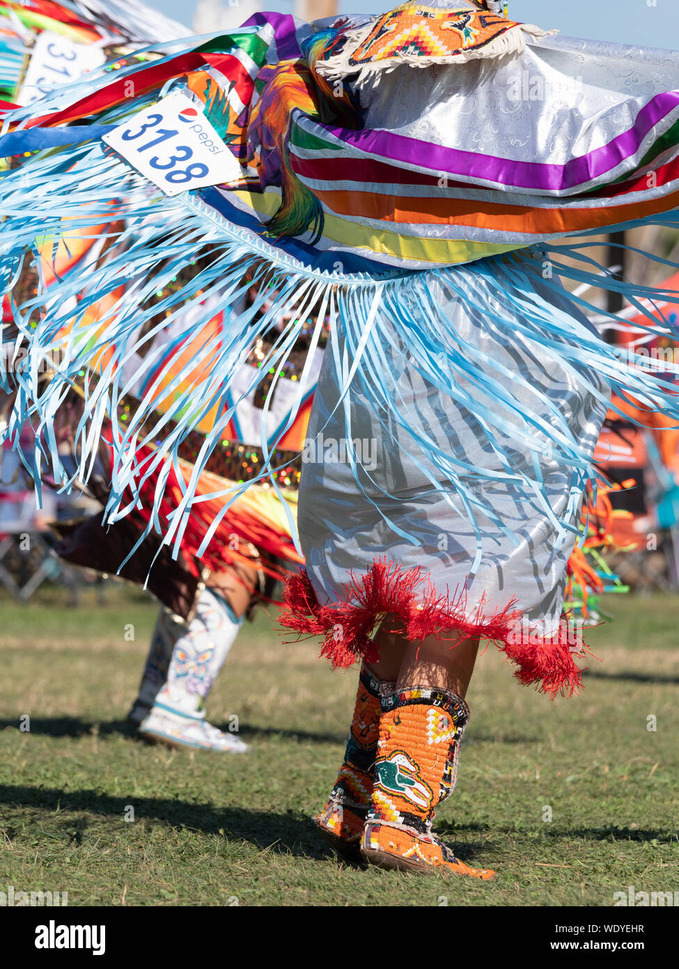 Native American women dancing with shawls with ribbon fringe at a pow wow  Stock Photo - Alamy