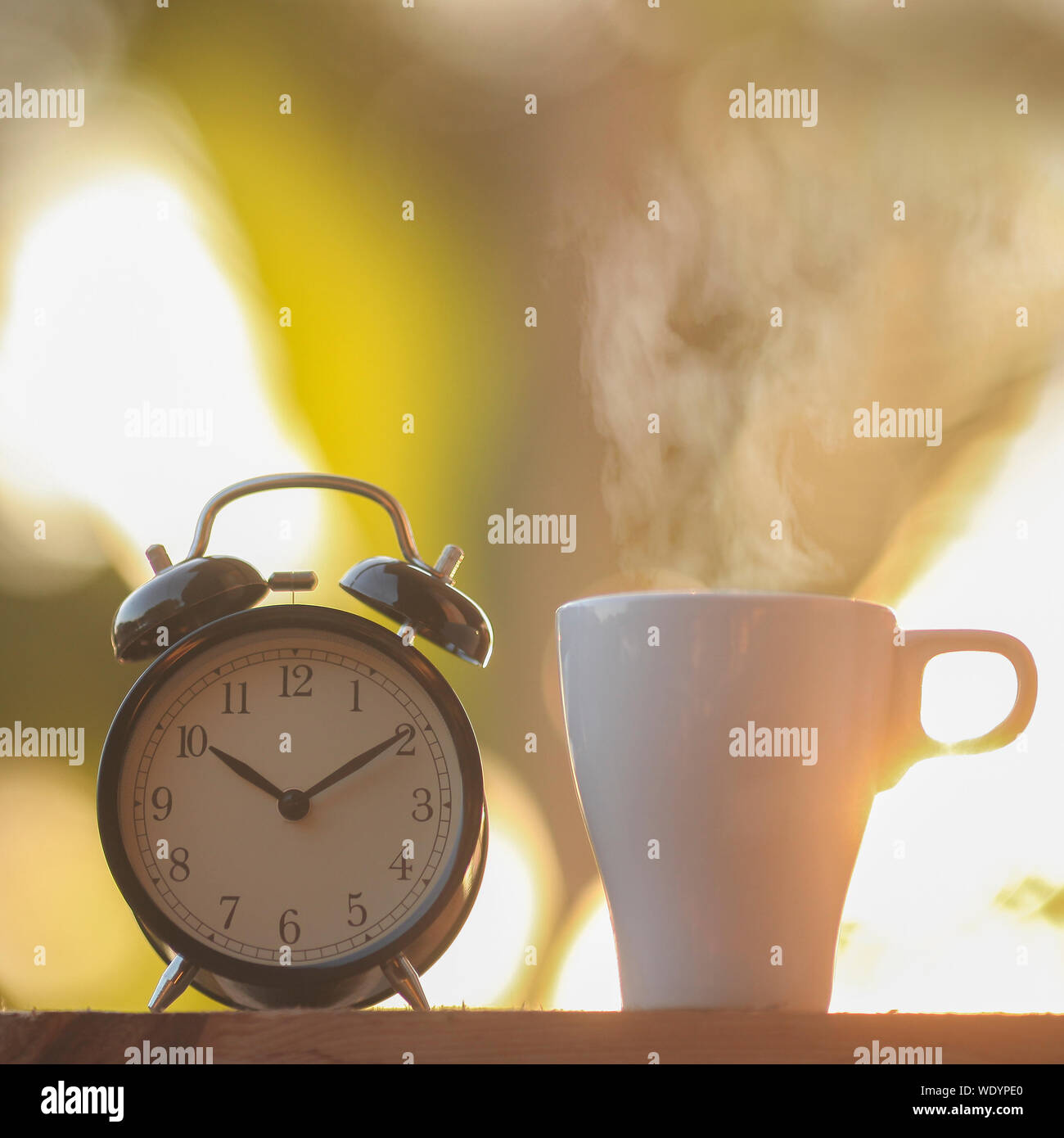Close Up Of Alarm Clock By Hot Coffee Cup On Table Stock Photo Alamy Close Up Of Alarm Clock By Hot Coffee Cup On Table Stock Photo Alamy