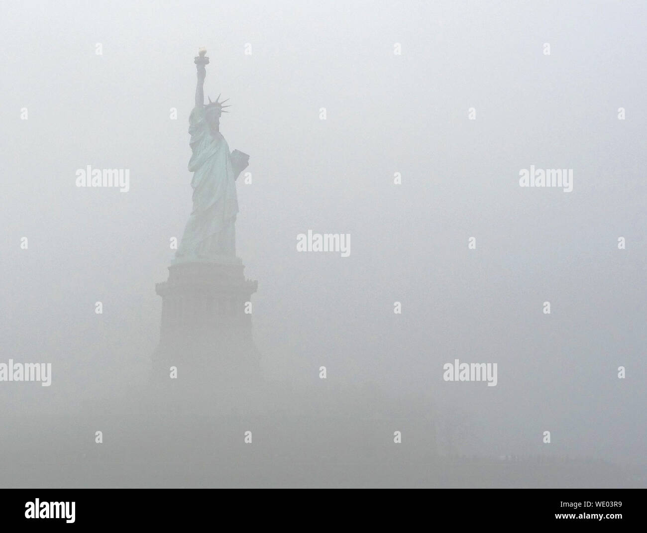 Statue Of Liberty In Foggy Weather Stock Photo Alamy